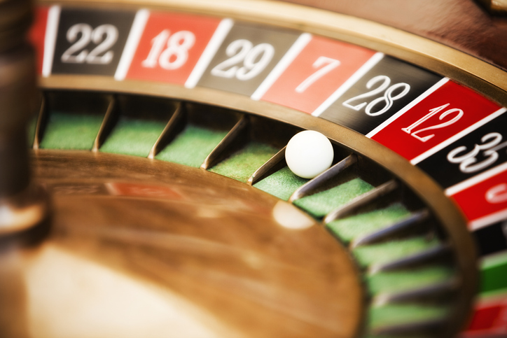 Roulette wheel in casino, close-up on No. 28.